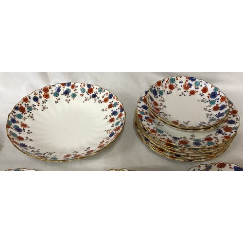 233 - A Royal Crown Derby part tea service decorated in blue and red flowers to include 6x cups, 8x saucer... 