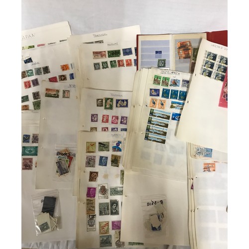 668 - A file of world stamps mounted on pages along with jubilee printed album, some loose stamps on paper... 