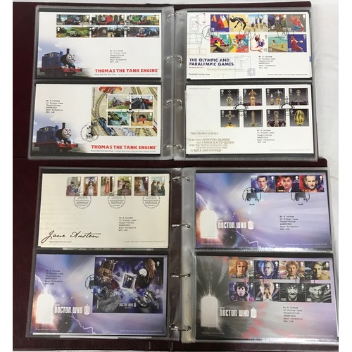 669 - Two royal mail first day cover albums and London 2012 team GB gold medal winners stamp album with ov... 