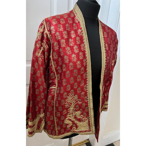 1055 - A vintage oriental jacket richly embroidered in gold thread work. Pockets to interior. Shoulder to h... 