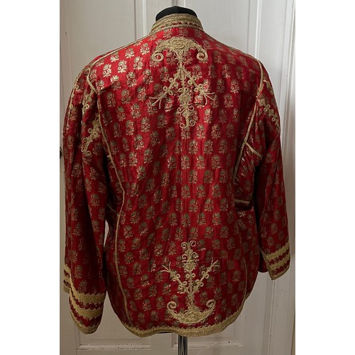 1055 - A vintage oriental jacket richly embroidered in gold thread work. Pockets to interior. Shoulder to h... 