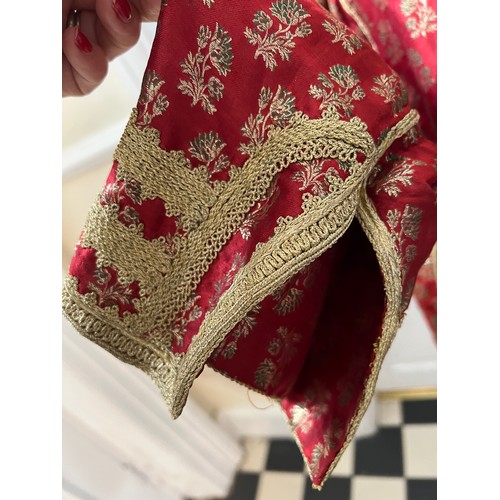 1055 - A vintage oriental jacket richly embroidered in gold thread work. Pockets to interior. Shoulder to h... 