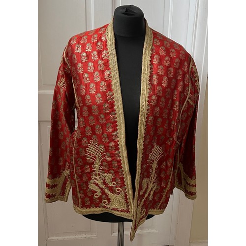 1055 - A vintage oriental jacket richly embroidered in gold thread work. Pockets to interior. Shoulder to h... 