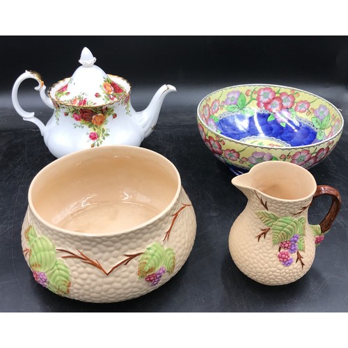 242 - Selection of four ceramic pieces to include two pieces of Wade china bramble pattern, a bowl 17cm di... 