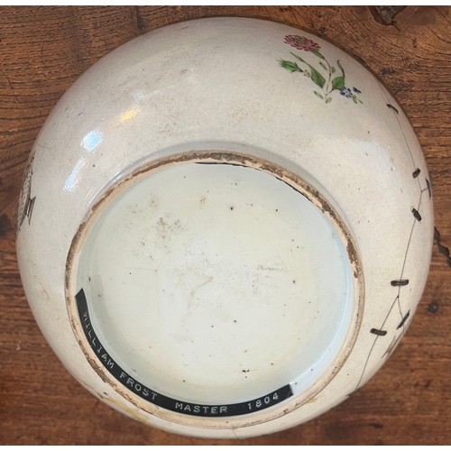 244 - An 18thC porcelain punch bowl 26cm d together with later wooden display stand. Purported to have be ... 