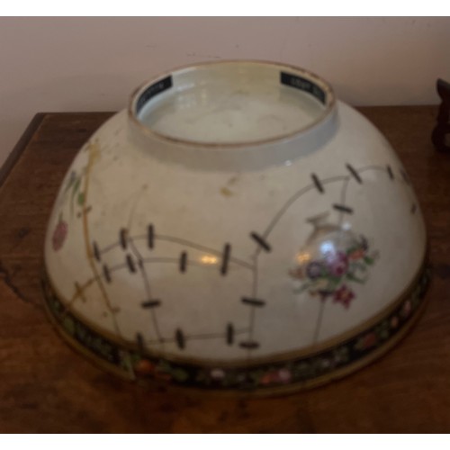 244 - An 18thC porcelain punch bowl 26cm d together with later wooden display stand. Purported to have be ... 