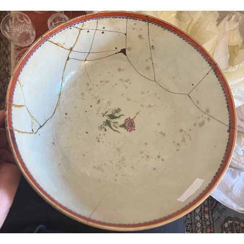 244 - An 18thC porcelain punch bowl 26cm d together with later wooden display stand. Purported to have be ... 