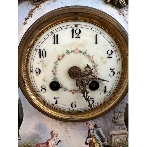 1021 - A French painted porcelain mantle clock with white enamel and floral decorated face. 27cm h.