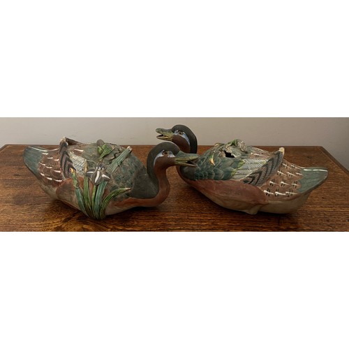 874 - Two Chinese duck sauce tureens. Modelled as a swimming duck with green reeds to one side. 22cm l.