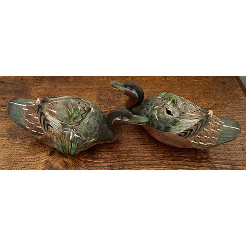 874 - Two Chinese duck sauce tureens. Modelled as a swimming duck with green reeds to one side. 22cm l.