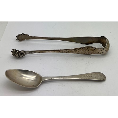 827 - French hallmarked sugar bows together with a bright cut teaspoon circa 1800. Weight 56gm.