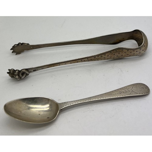 827 - French hallmarked sugar bows together with a bright cut teaspoon circa 1800. Weight 56gm.