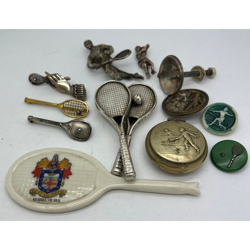 648 - Tennis related items to include white metal brooches, buttons, lidded box, crested ware racket etc.