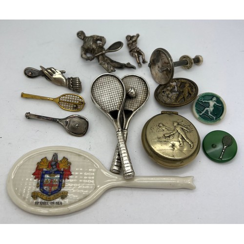 648 - Tennis related items to include white metal brooches, buttons, lidded box, crested ware racket etc.