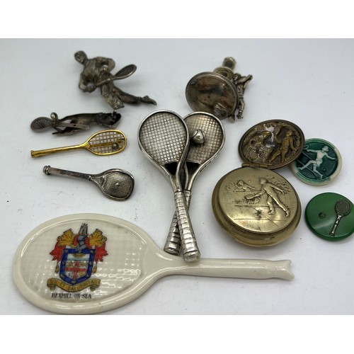 648 - Tennis related items to include white metal brooches, buttons, lidded box, crested ware racket etc.