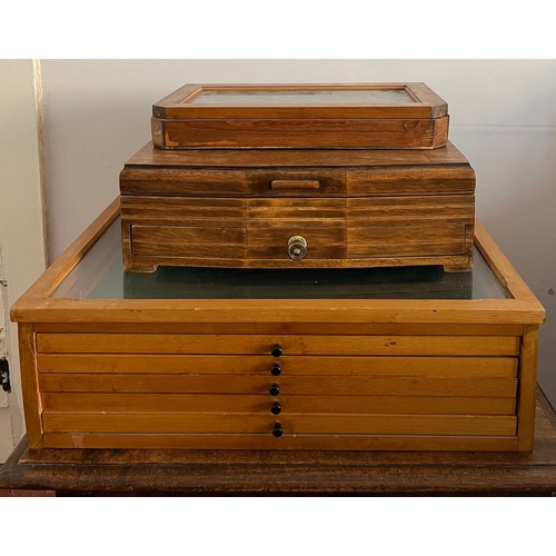 729 - Three various display boxes to include multi drawer cabinet, unfitted oak cutlery box and a clear gl... 