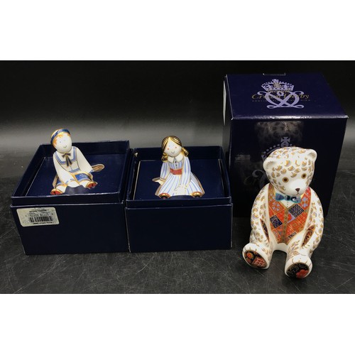 254 - A collection of royal crown derby to include Teddy Bear with blue bow tie paperweight with gold stop... 