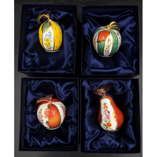 255 - A collection of Royal Worcester fruit themed candle snuffers to include pear, apple, peach and lemon... 