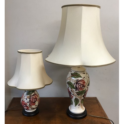 749 - Two matching Moorcroft table lamps with pink flower design tallest to top of shade 75cm.