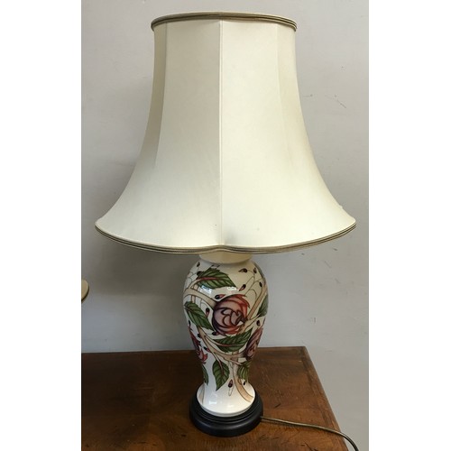 749 - Two matching Moorcroft table lamps with pink flower design tallest to top of shade 75cm.