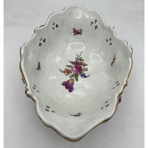 259 - Continental porcelain basket with floral and gilt decoration. 24 x 16cm.