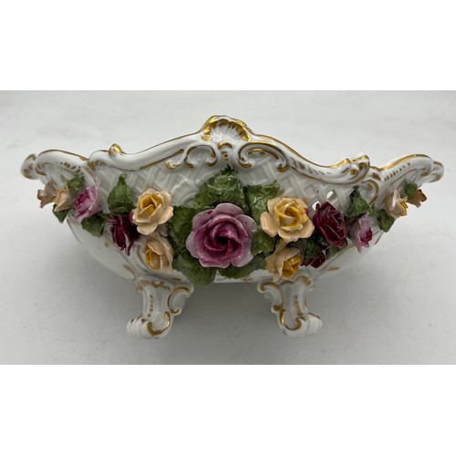 259 - Continental porcelain basket with floral and gilt decoration. 24 x 16cm.