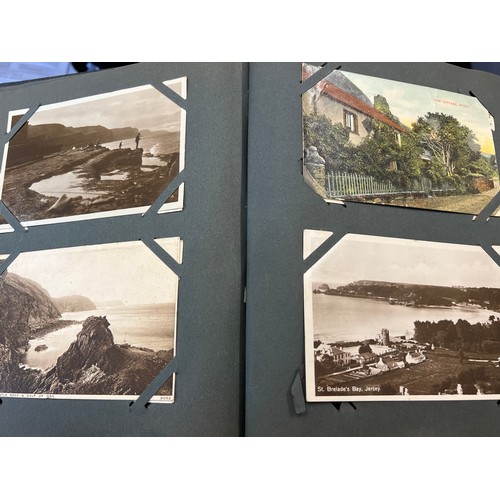 1289 - Two vintage postcard albums and contents to include views of Staithes, Whitby, Exeter, York, Filey, ... 