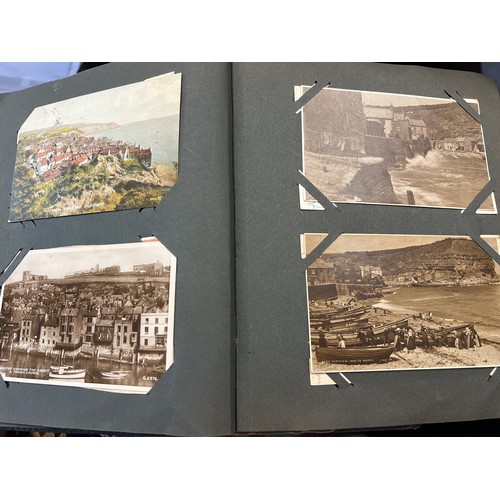 1289 - Two vintage postcard albums and contents to include views of Staithes, Whitby, Exeter, York, Filey, ... 