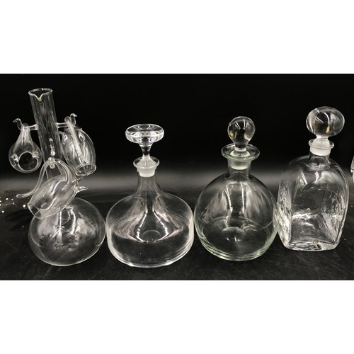 365 - A collection of glassware to include a port sipper decanter with three glasses and three decanters o... 