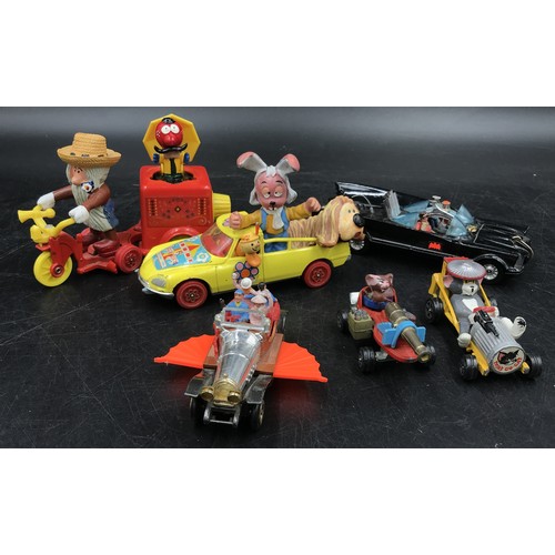 912 - A collection of vintage children's toy cars from film and TV to include Corgi Toys The magic roundab... 