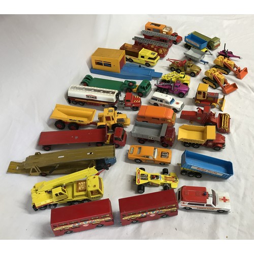 915 - A collection of Matchbox cars, trucks, buses and trailers from collections such as Speed Kings, Supe... 