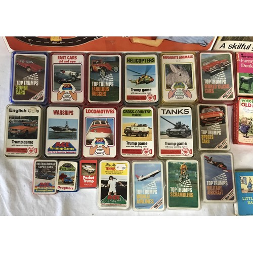 917 - A collection of vintage games to include four card games by WHSmith Woodland Old maid, Rupert A Pepy... 