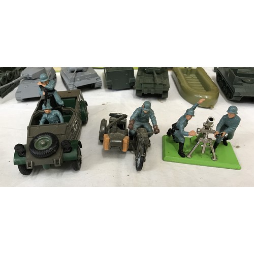 919 - A collection of army toys to include three pieces of Britains: German Kubelwagen Scout Car, German B... 