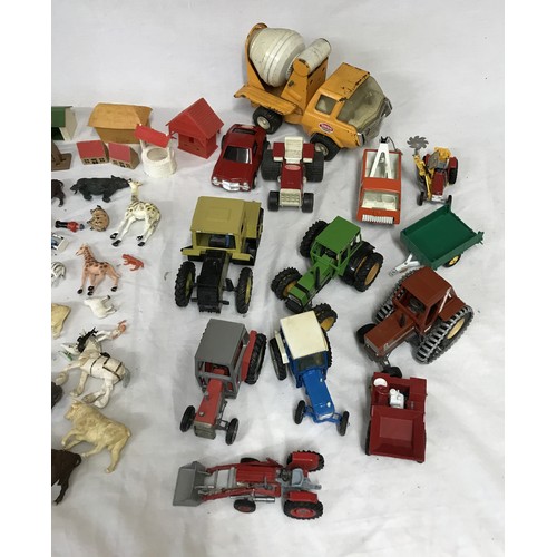 920 - A collection of toys to include four Tonka vehicles to include a cement mixer, tractor, tow truck an... 