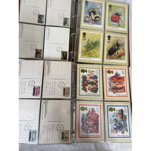 672 - Two boxes to include 2 x Royal Mail F.D.C albums 1980's covers, 2 x Royal Mail P.H.Q. card albums an... 