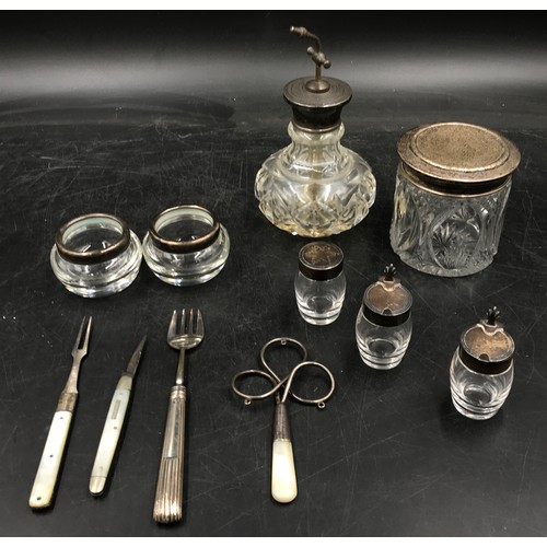 837 - Miscellaneous collection of silver embellished items to include two trinket dishes, a very small con... 