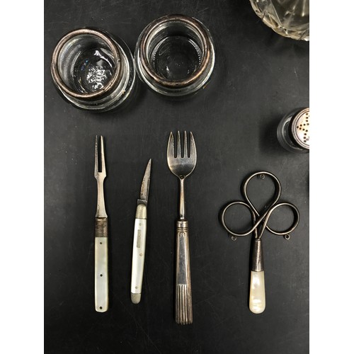 837 - Miscellaneous collection of silver embellished items to include two trinket dishes, a very small con... 