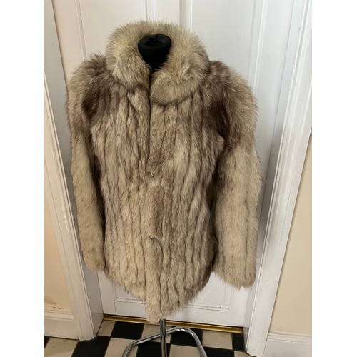 1056 - A vintage silver fox fur jacket. Nape to hem 74cm. Armpit to armpit 47cm.