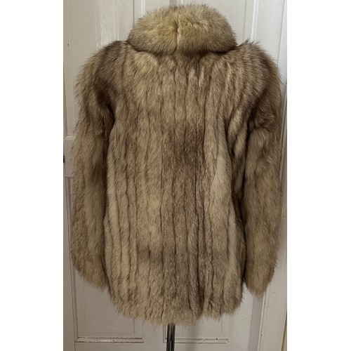 1056 - A vintage silver fox fur jacket. Nape to hem 74cm. Armpit to armpit 47cm.