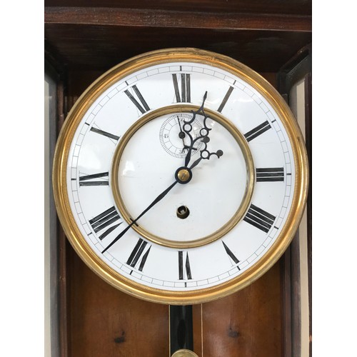 1023 - Burr walnut Vienna style wall clock with barley twist decoration to sides, circular enamel dial havi... 