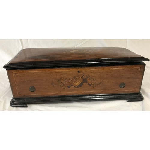 731 - A cylinder inlaid mahogany musical box. The cylinder 27.5cms long and mechanism in working order. Ca... 