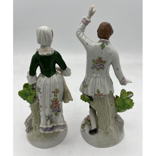 269 - A pair of Sitzendorf figures of shepherds. 16cm h.