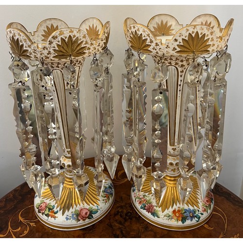 276 - A pair of Bohemian overlay glass lustres with gilt and floral decoration. 31cm h.