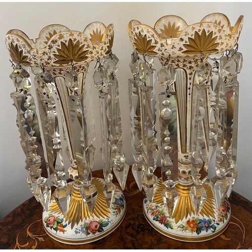 276 - A pair of Bohemian overlay glass lustres with gilt and floral decoration. 31cm h.