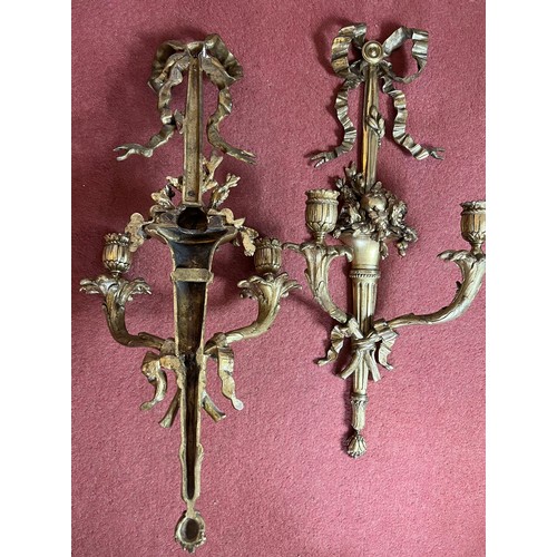 754 - A pair of good quality decorative ormolu wall sconces. 55cm h.