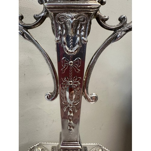 777 - A pair of good quality late 19thC silverplated twin branch candelabras with square bases decorated w... 