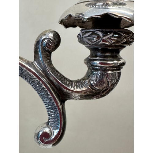 777 - A pair of good quality late 19thC silverplated twin branch candelabras with square bases decorated w... 