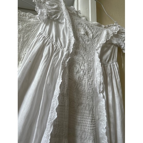 1061 - Five late 19thC/ 20thC christening gowns with panelled broderie anglaise together with an underskirt... 