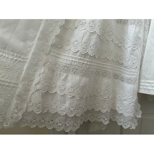 1061 - Five late 19thC/ 20thC christening gowns with panelled broderie anglaise together with an underskirt... 