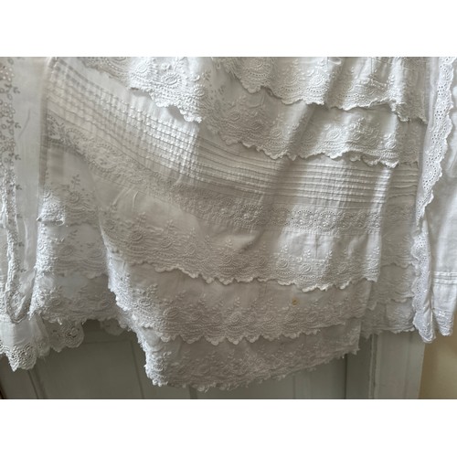 1061 - Five late 19thC/ 20thC christening gowns with panelled broderie anglaise together with an underskirt... 